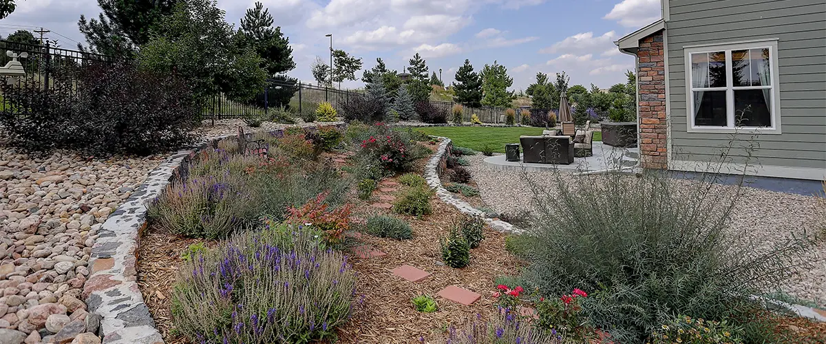 Xeriscaping in Bennett, CO with pavers, stones, plants, and gravel