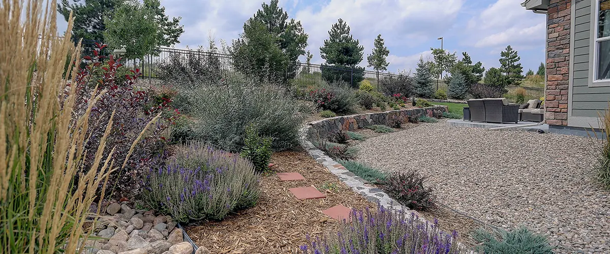 Beautiful residential rock, stone, and plant xeriscape landscaping in arid climate