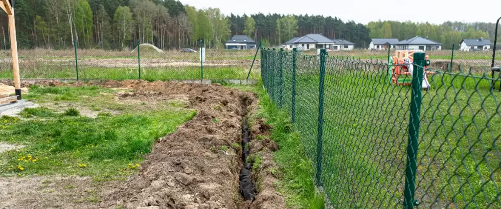 A construction site featuring a newly dug trench after excavation